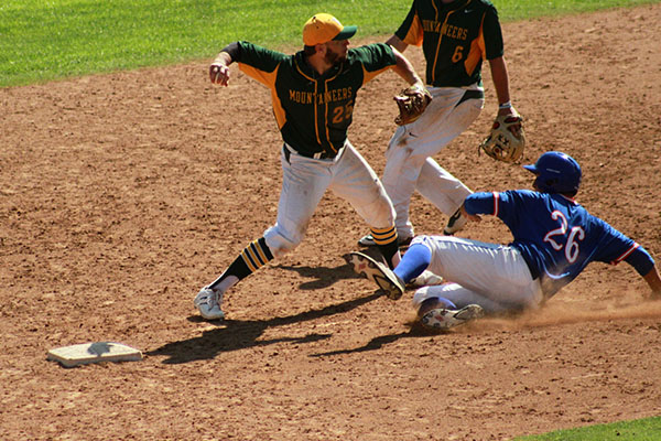 john arancio turns a double play at second base against pomona pitzer