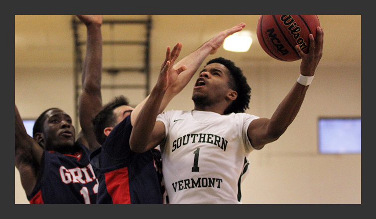 damon daniel goes up for a layup against a nec defender