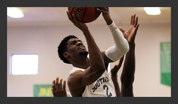 donnell frayer jr goes up with the ball trying to sccore