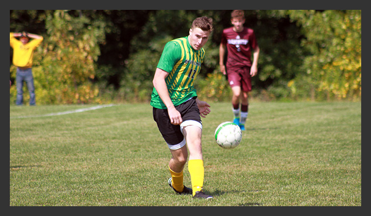 zach gilman kicks the ball