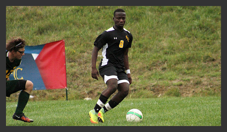 ray awusi controls the ball