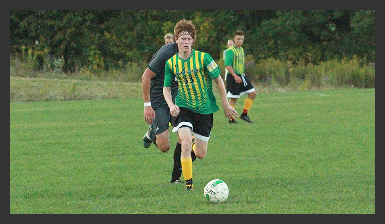 ethan pallen dribbles the ball