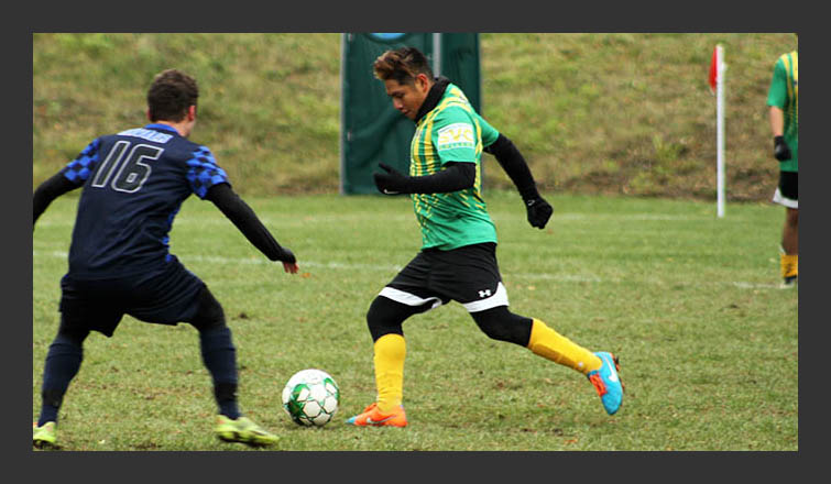 omar santiago-rodriguez dribbles the ball