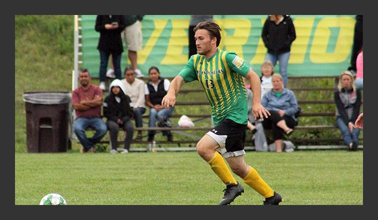 tim carper dribbles the ball