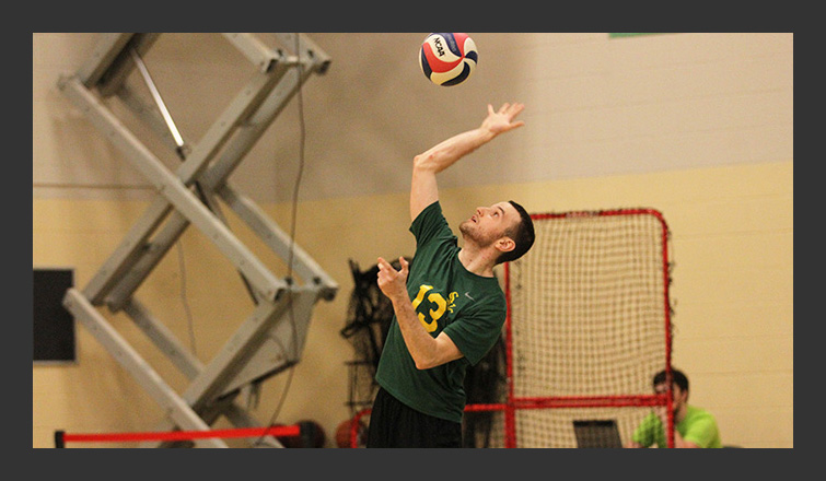 adrian dickerson hits the volleyball