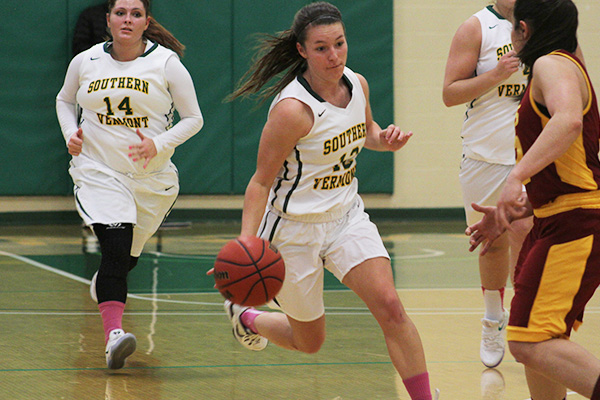 Taylor Mallett dribbles up the court