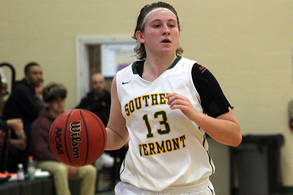 Danielle Biggers dribbles down the court