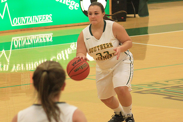 Bree Soucey dribbles the ball up the court