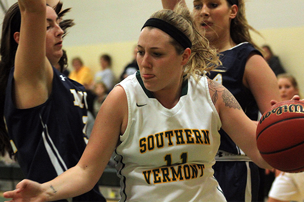 Chloe Longe dribbles the ball against MCLA