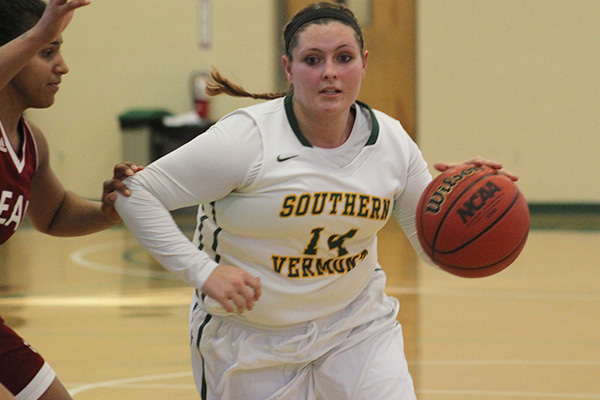 amber dow dribbles the ball against dean
