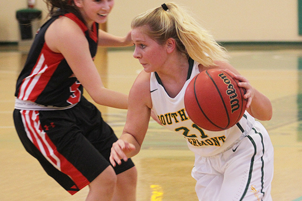 amber lesure dribbles the ball