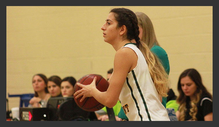 STEPHANY FERREIRA LOOKS TO PASS THE BALL