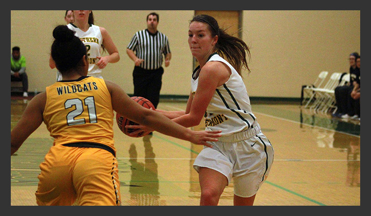 taylor mallett drives the ball to the hoop