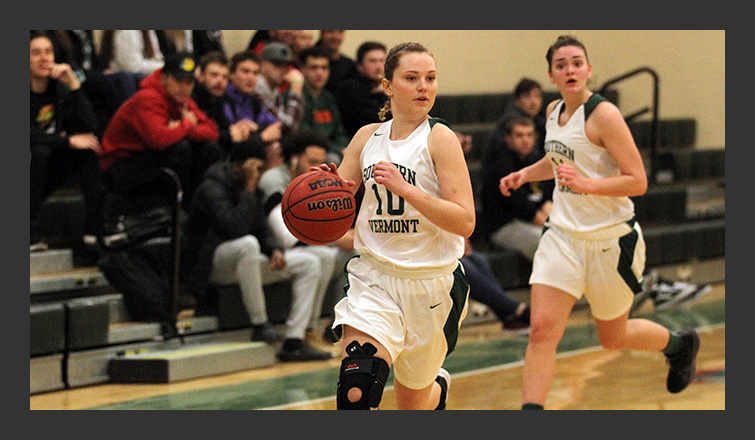 katie godon dribbles the ball up the court