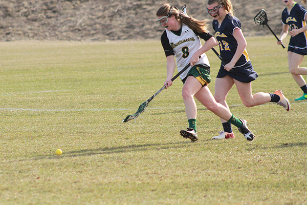 mel orrell scoops up the ball