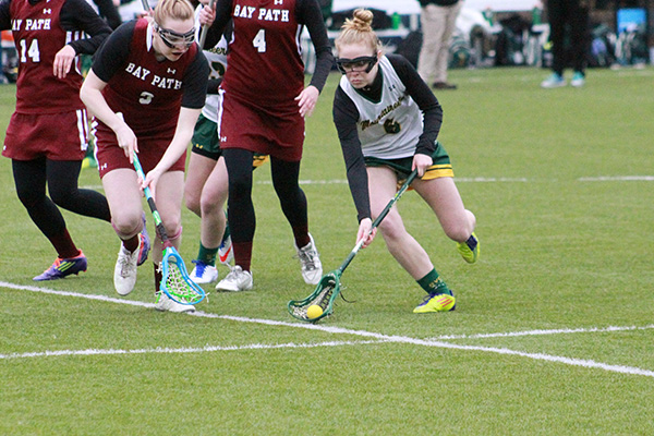 emily lesure scoops up a loose ball