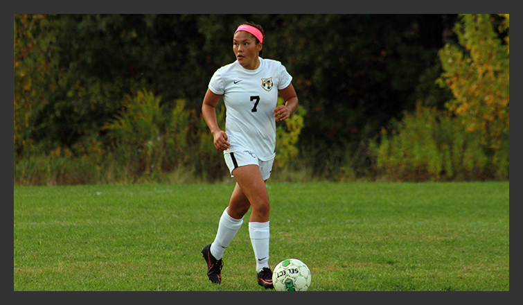 taylor jarosz dribbles the ball