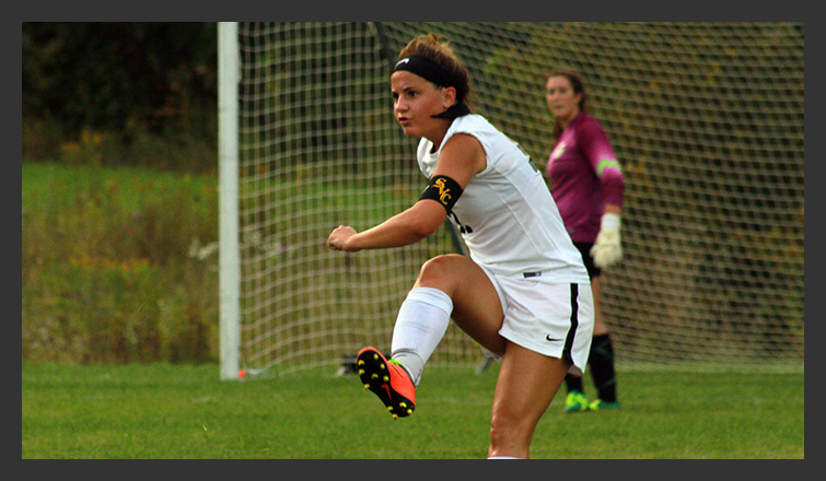 molly madore kicks the ball
