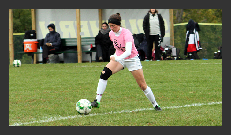 ally mcnamee takes a touch on the ball