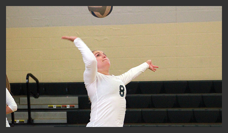 danny beaumier serves the ball